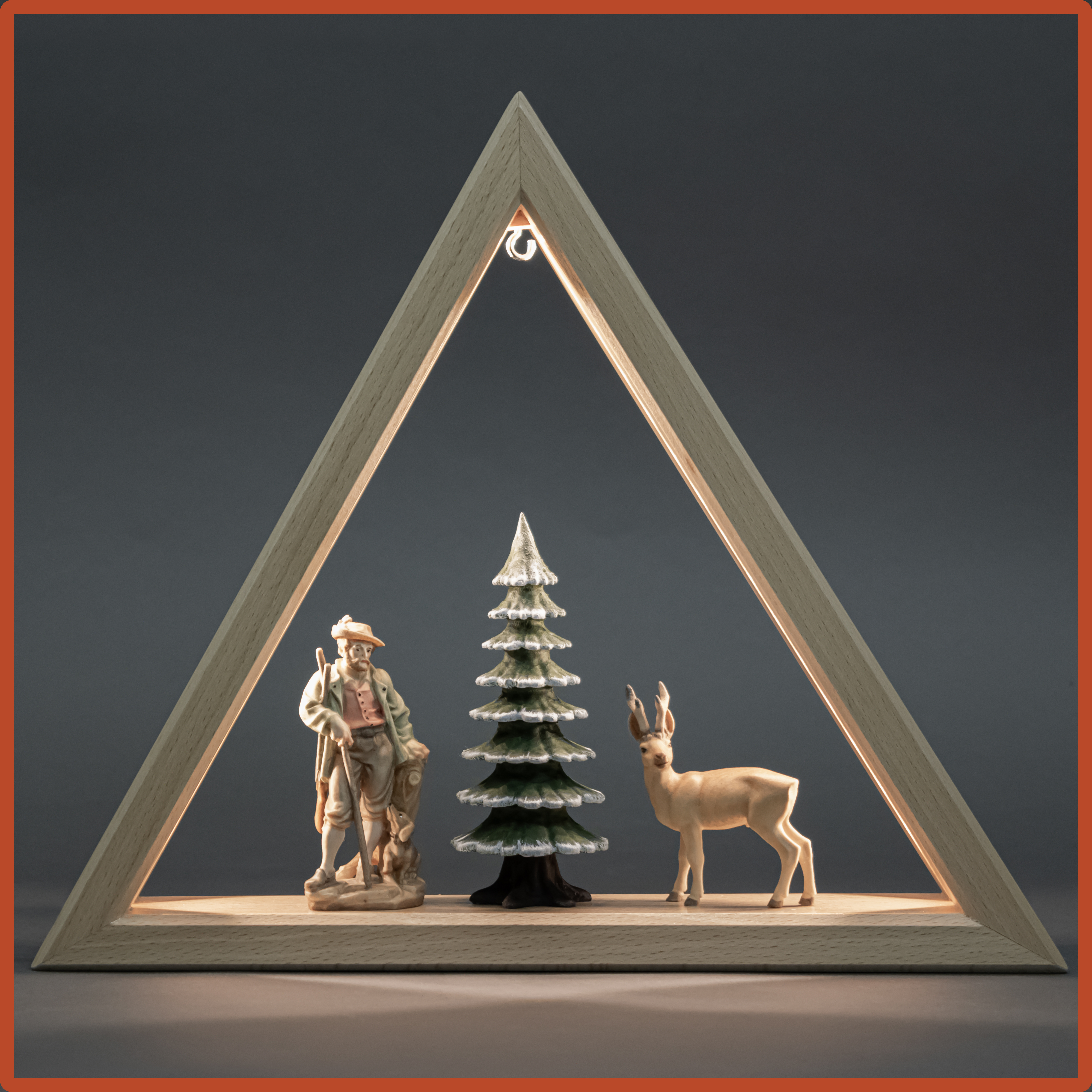 Illuminated triangle with forest motifs